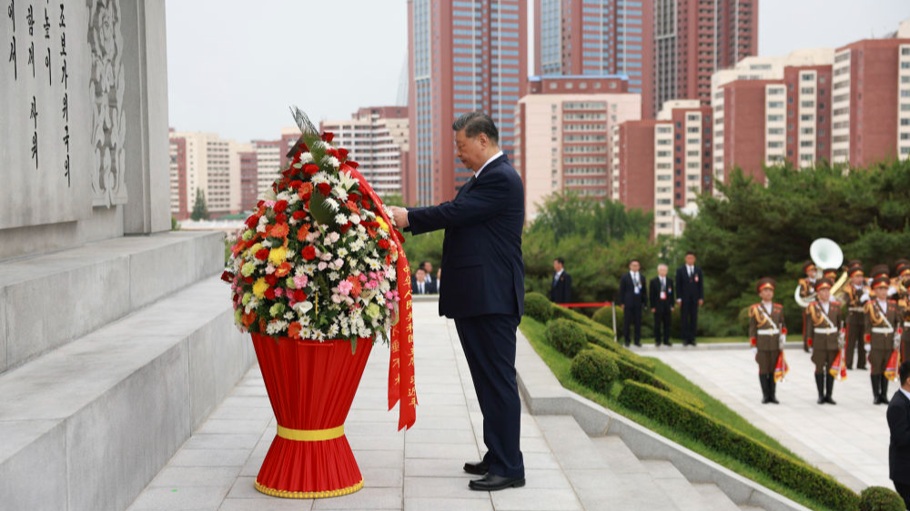 Xi, Kim pledge to carry forward great traditional China-DPRK friendship through generations