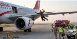 Passenger jumps from plane through emergency exit 