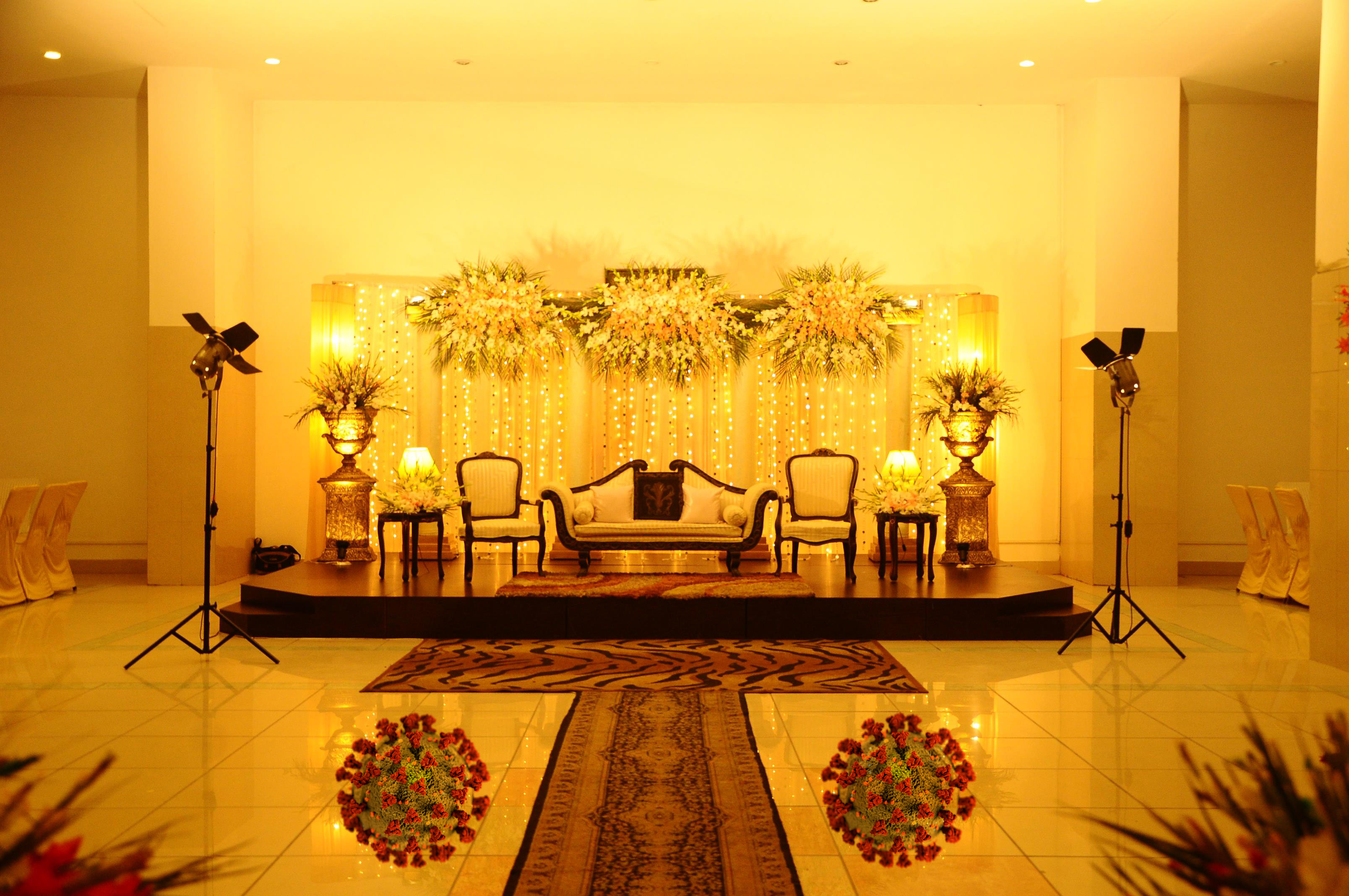 As the coronavirus spreads, and the government mulls a lockdown, wedding halls stand defiant