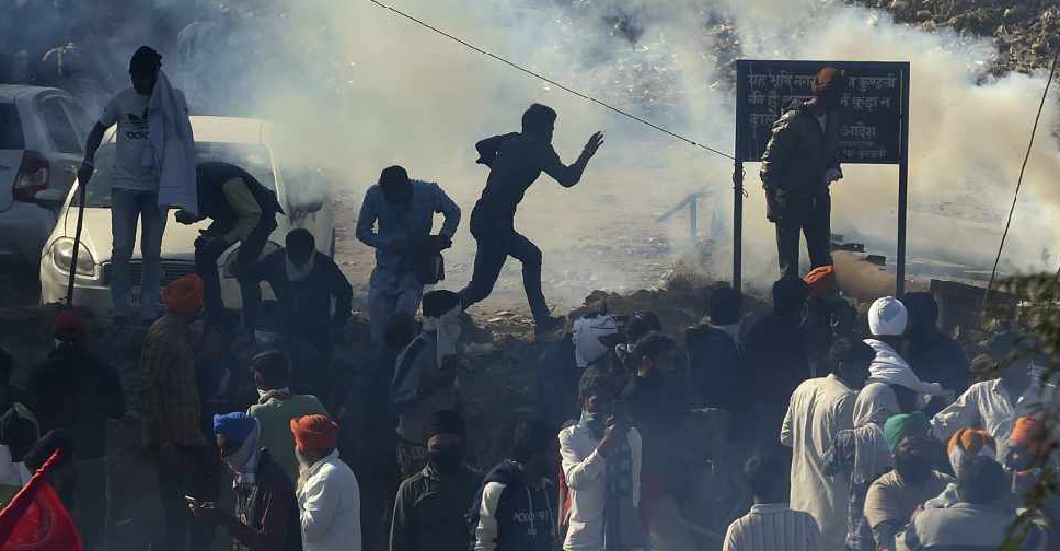 Indian farmers defiant against reform as Modi tries to calm anger