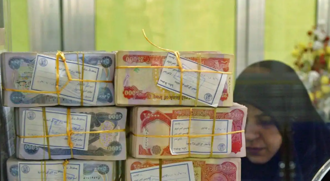 Iraq devalues dinar as oil prices squeeze revenues