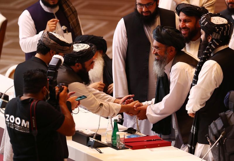 Afghan rivals to resume talks as civilian killings sow suspicion