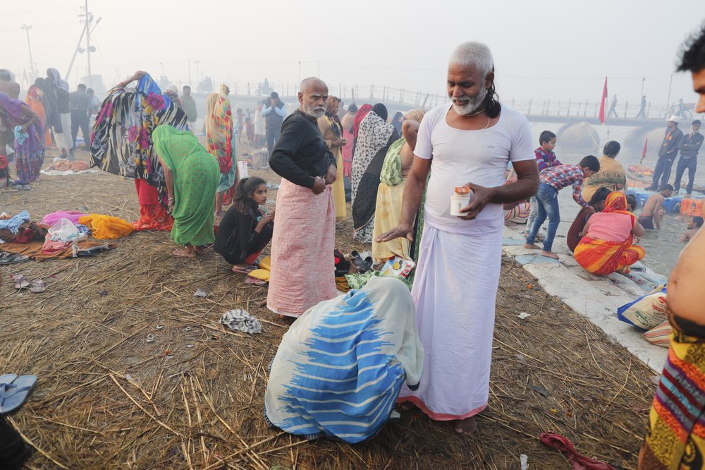 Hindu festival draws crowds of bathers to rivers
