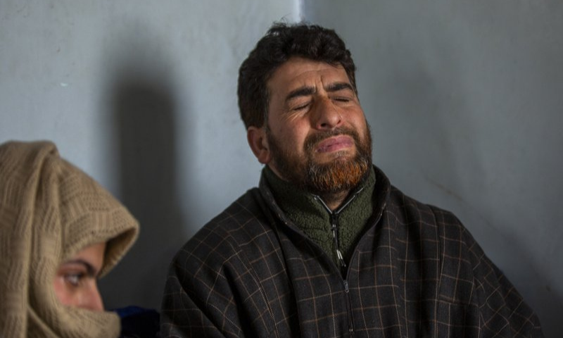 Man seeking son's body charged under anti-terror law in occupied Kashmir