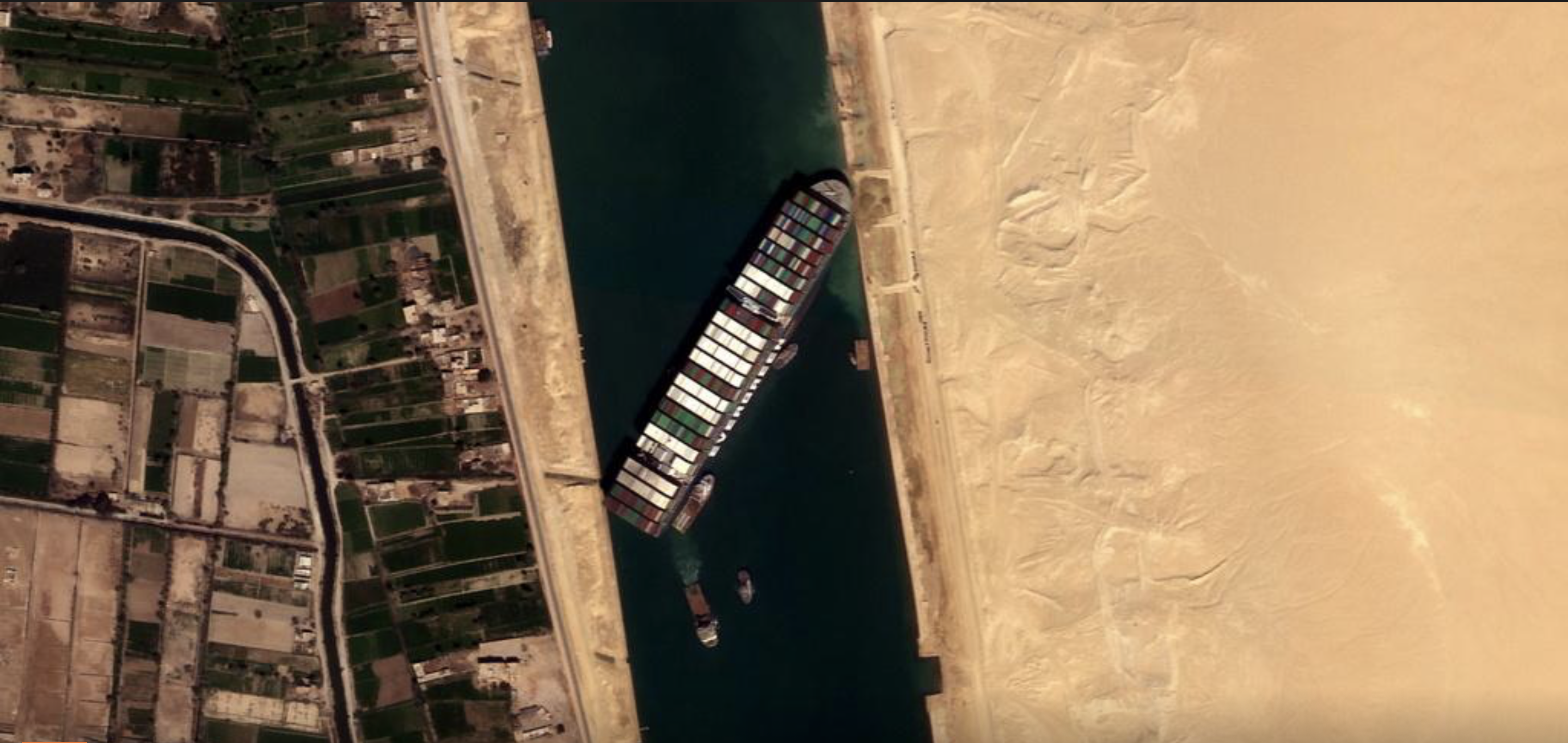 Tugs, dredgers still struggle to free ship blocking Suez Canal