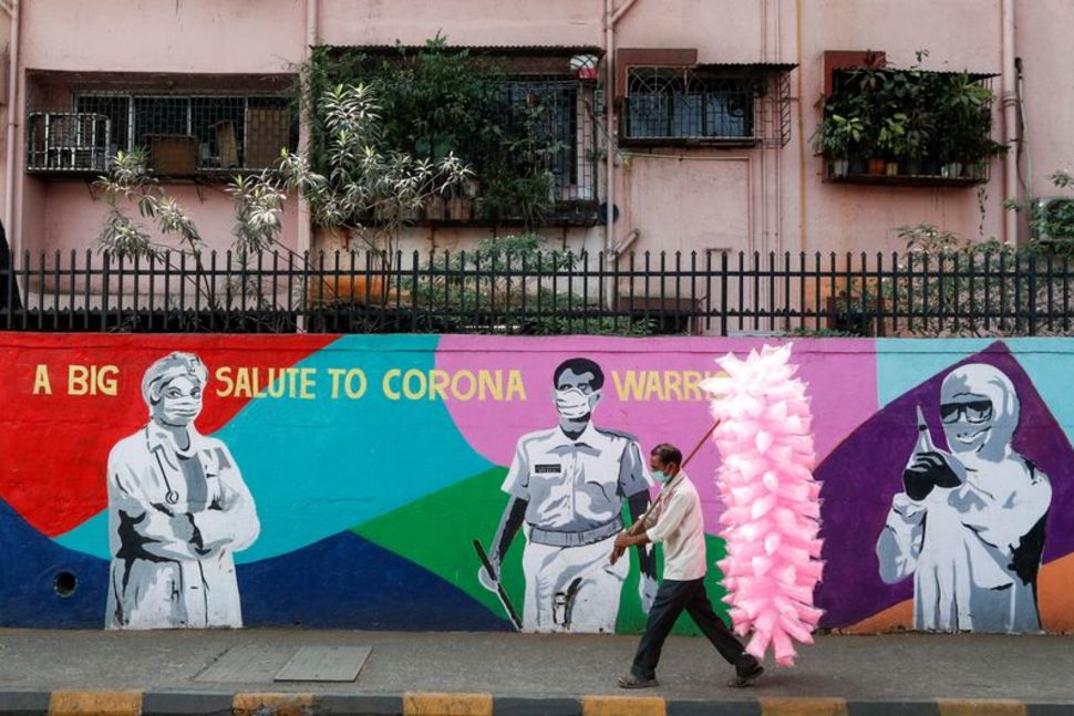 India widens coronavirus curbs as infections top 20,000 for sixth day