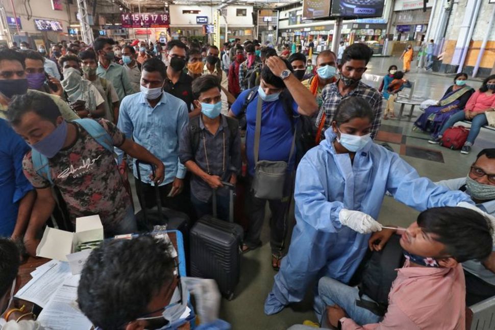 India's coronavirus cases peak over 12 million for first time