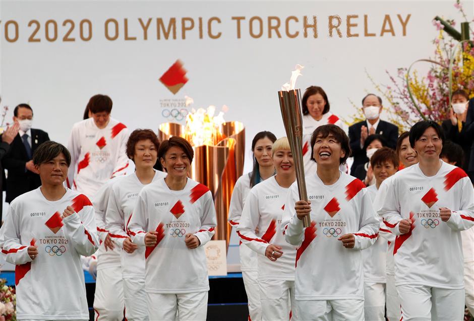 One year late, virus-delayed Tokyo Olympic torch relay begins