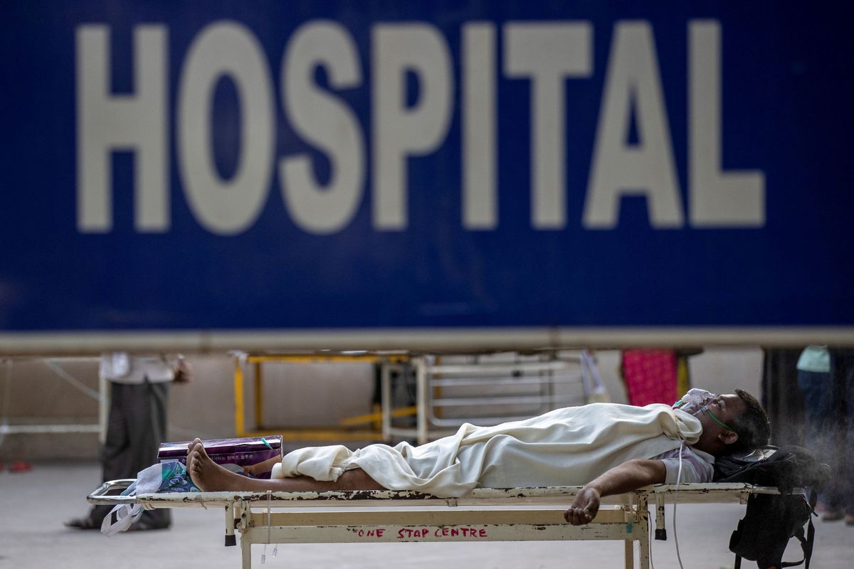 Covid-19 patients die on trolleys outside Delhi hospital