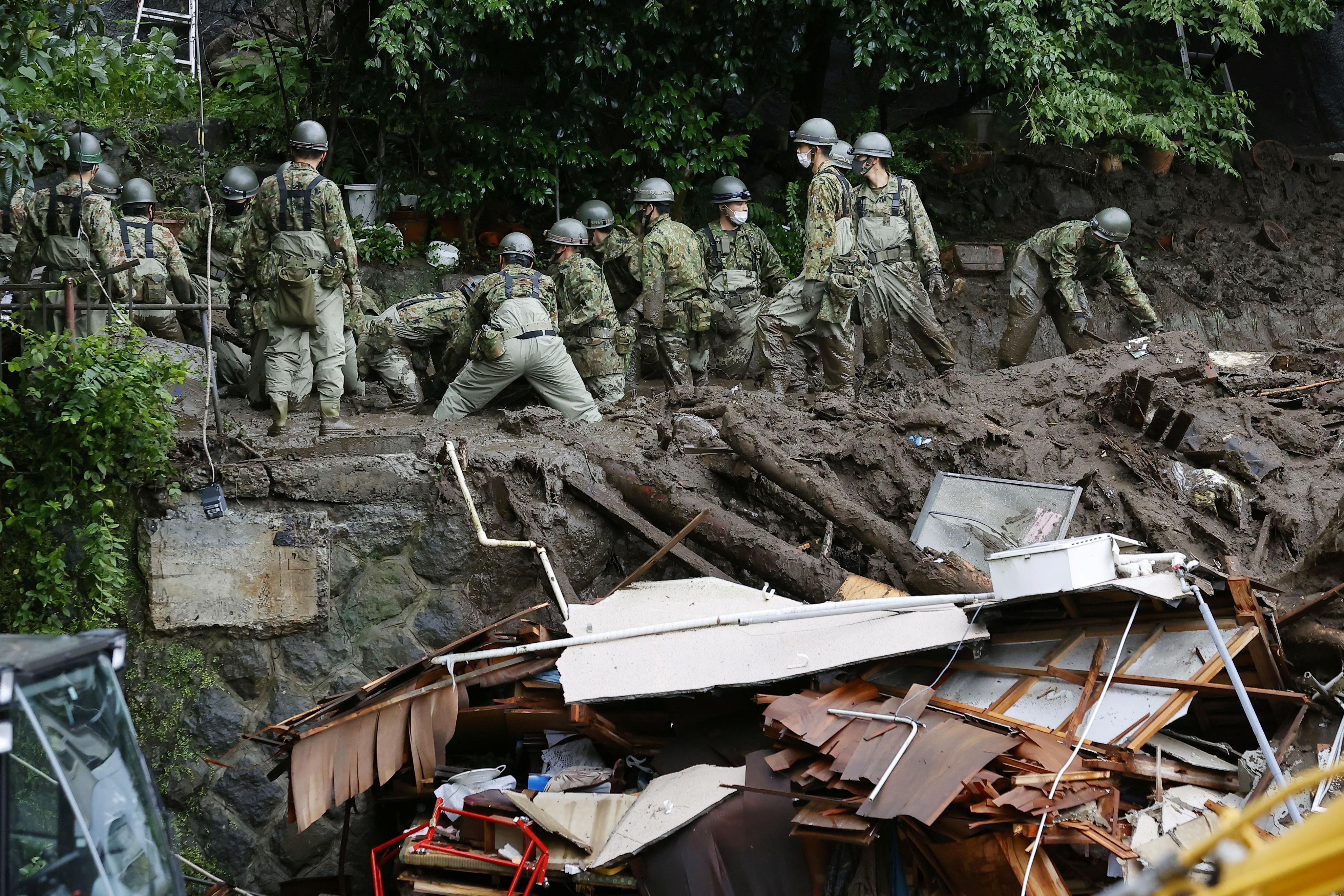 Rescuers fight time, weather in Japan landslide; some 80 missing