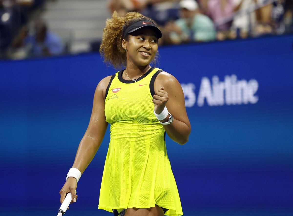 Osaka overcomes stumble to make Australian Open second round