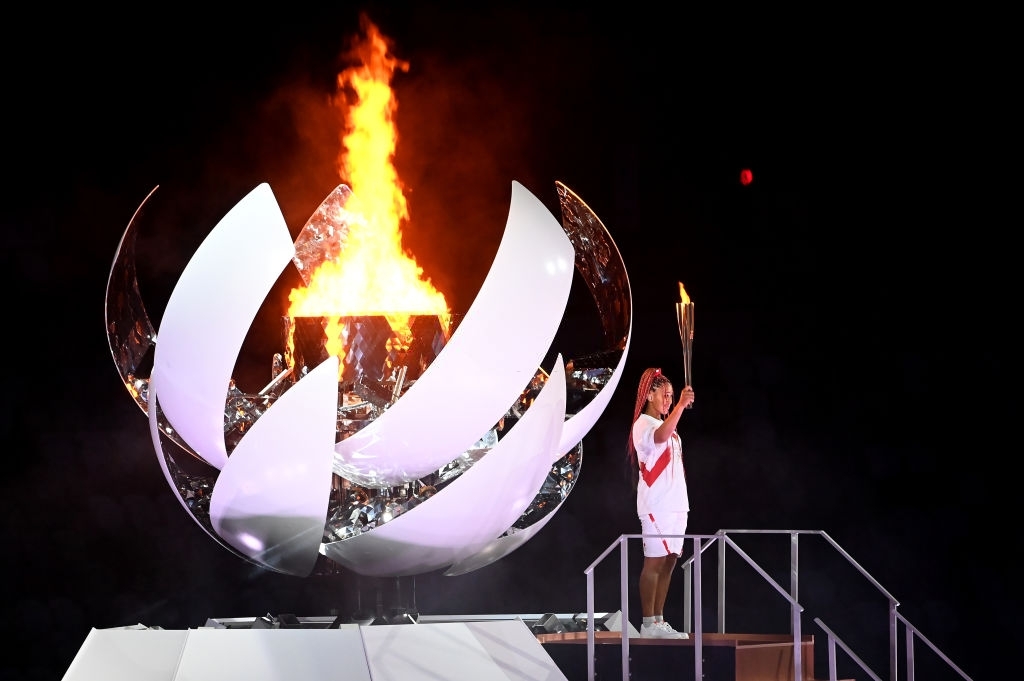 Japan to douse Olympic flame of Games transformed by pandemic and drama
