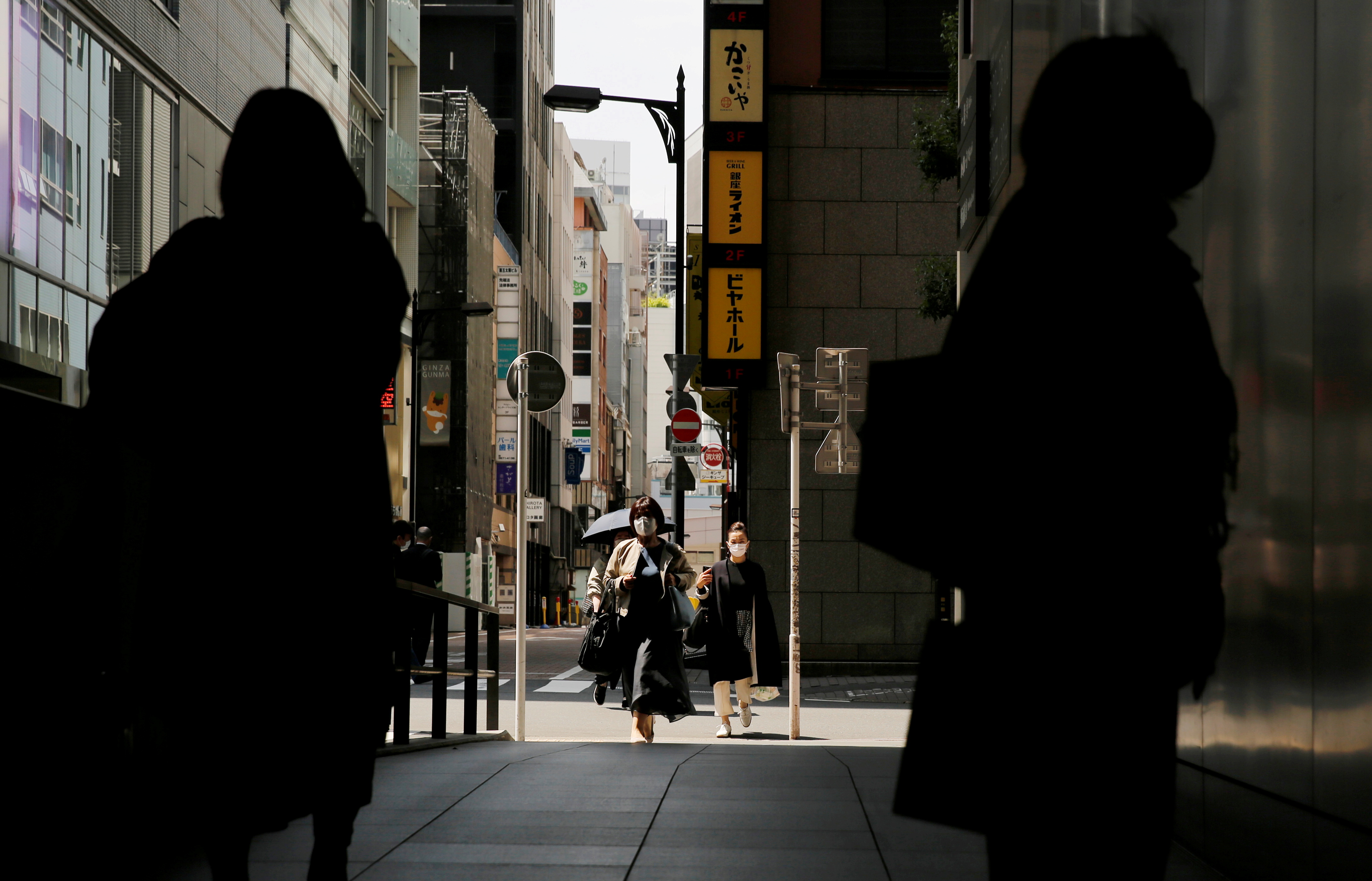 Japan expands Covid-19 curbs as surges strain hospitals