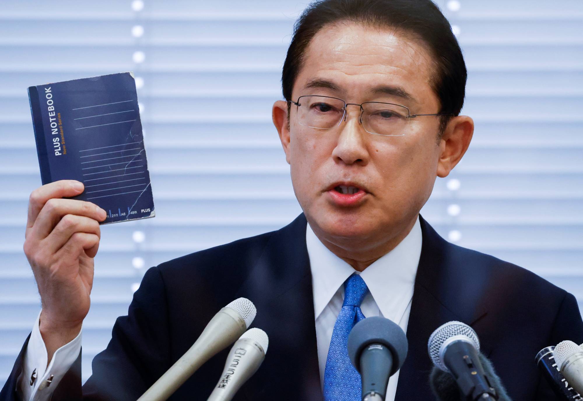 Japan’s Parliament elects former diplomat Kishida as new PM