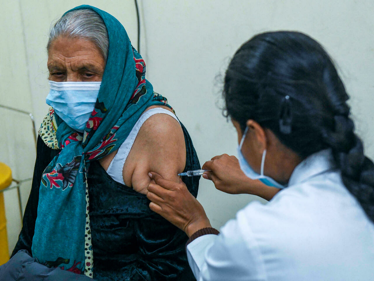 India begins booster campaign as Omicron cases soar