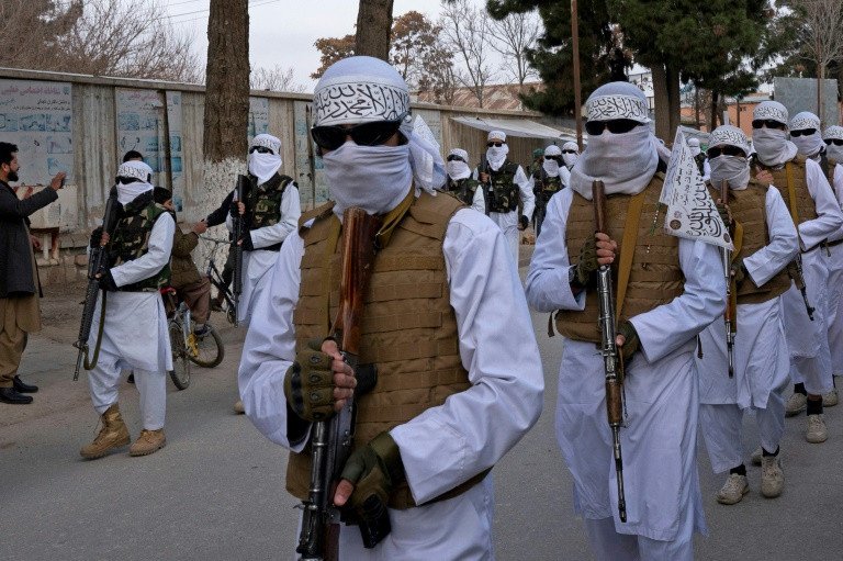 Taliban stage show of strength with parade after protests