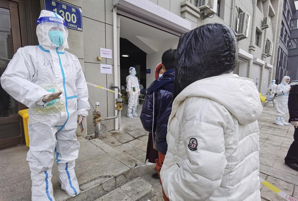 China locks down city of 9 million amid new spike in Covid-19 cases