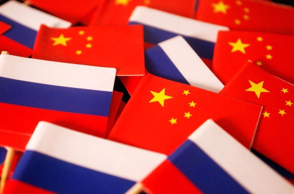 China, Russia 'more determined' to boost ties, Beijing says