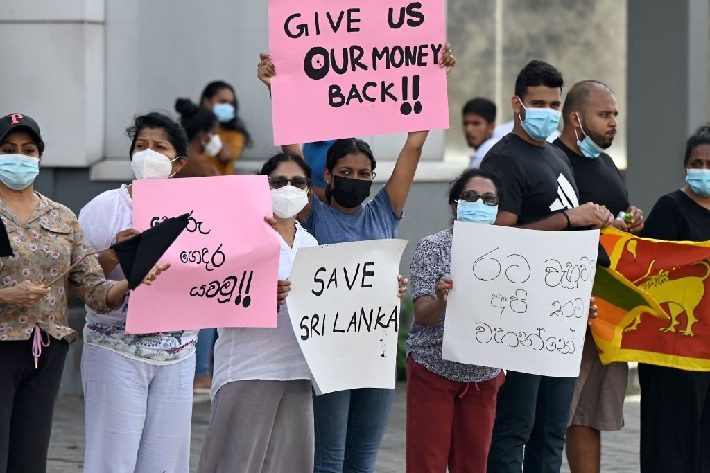 Troubled Sri Lanka set for new cabinet and protests