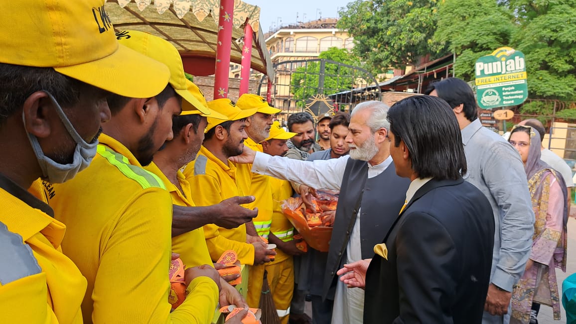 Kh Hassan distributes sweets to LWMC workers for good performance