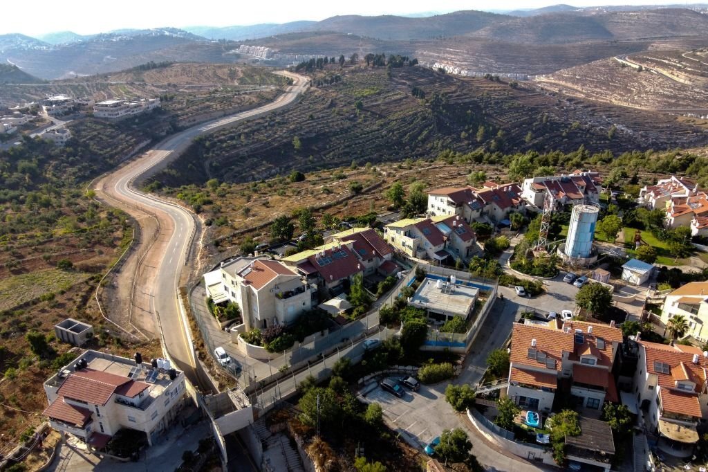 Palestinian family encircled by Israeli settlement