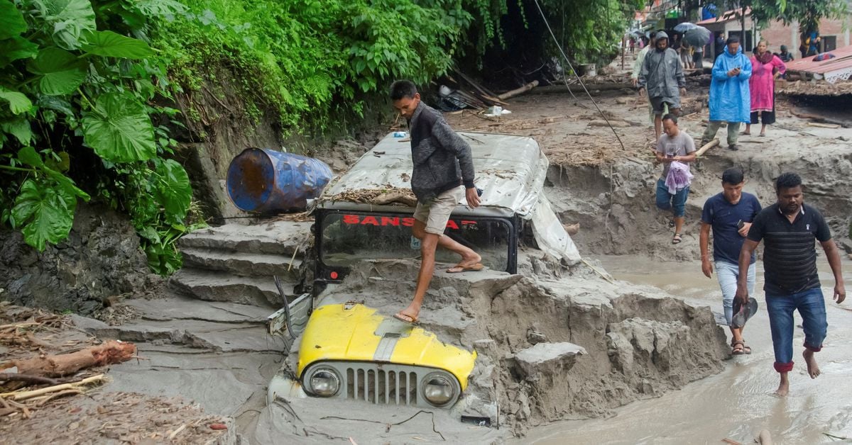 Indian rescuers struggle to reach flood-hit areas where over 100 go missing