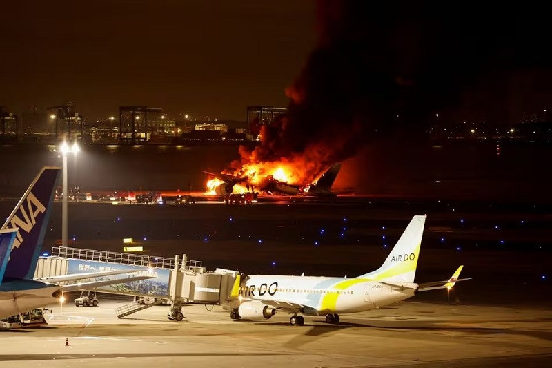 All passengers, crew escape fireball on Japan Airlines plane after airport collision