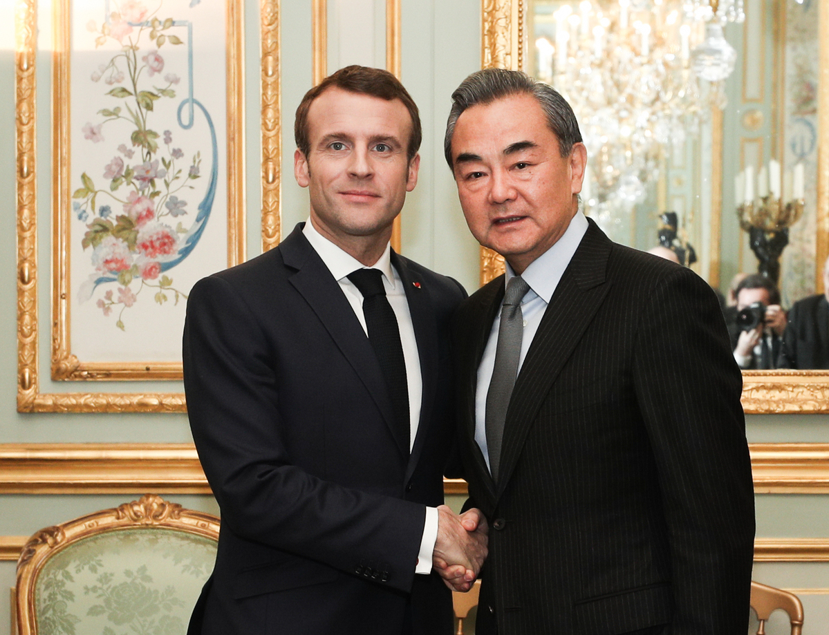 Wang Yi meets France's Emmanuel Macron to mark 60 years of Sino-French relations
