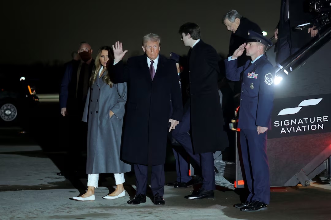 Trump arrives in Washington as inauguration celebrations begin with Elvis impersonator, fireworks