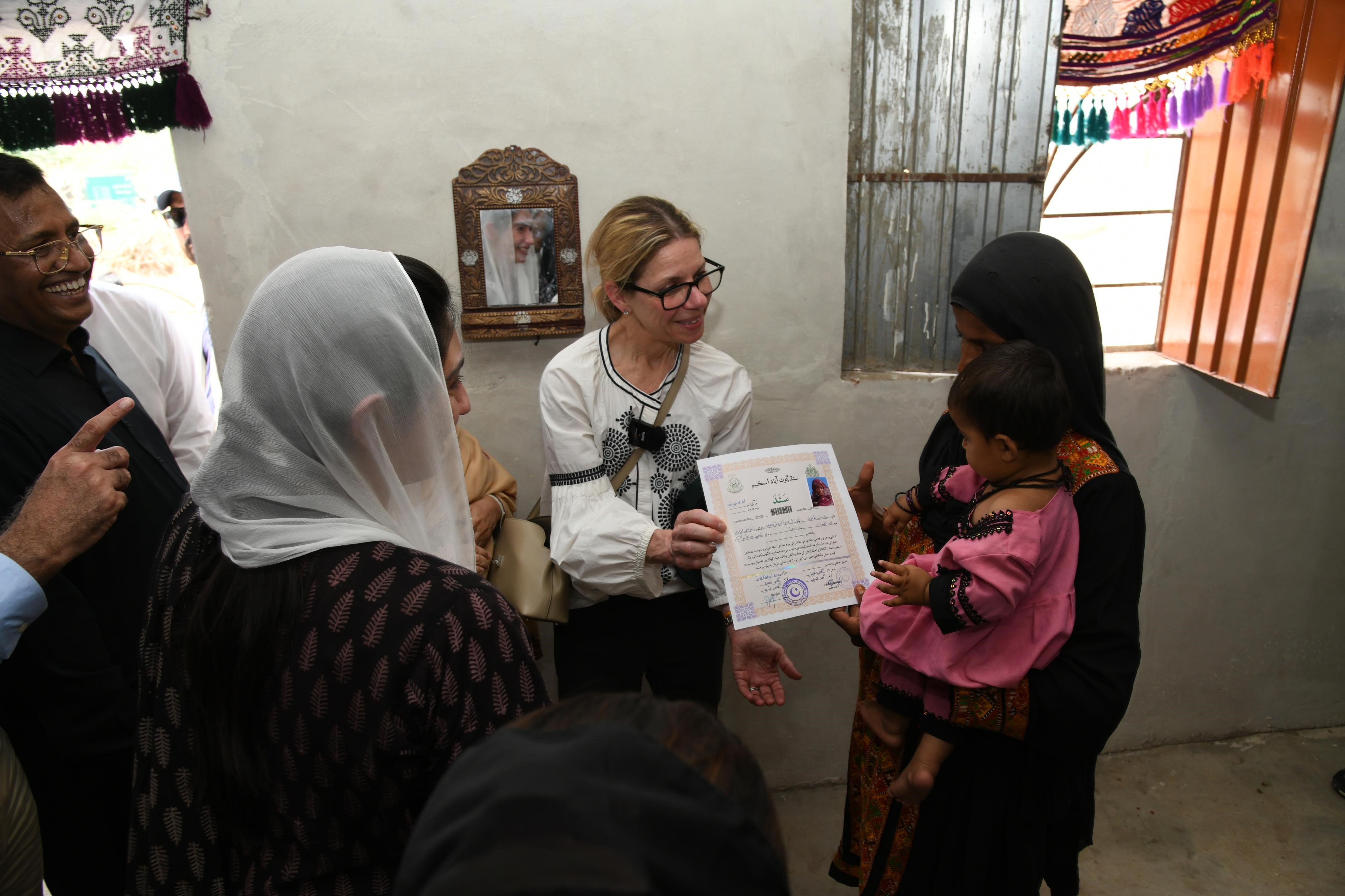 Aseefa, WB officials hands over house ownership certificates to flood-hit families