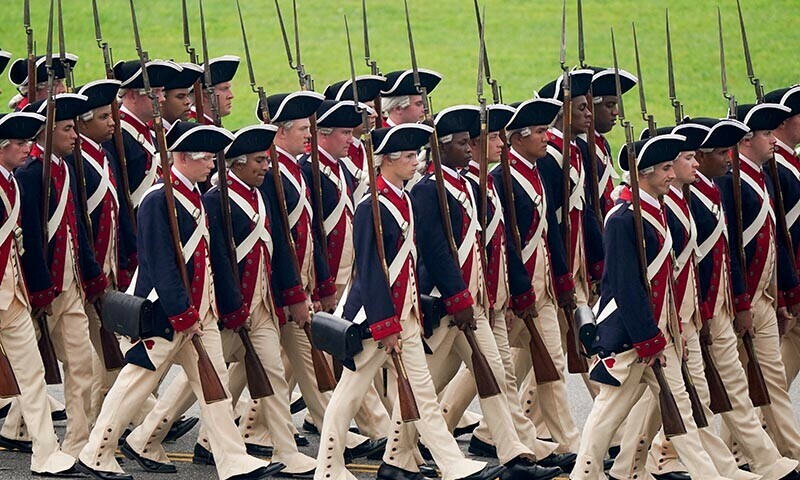 Trump flexes military might at parade as protests sweep US