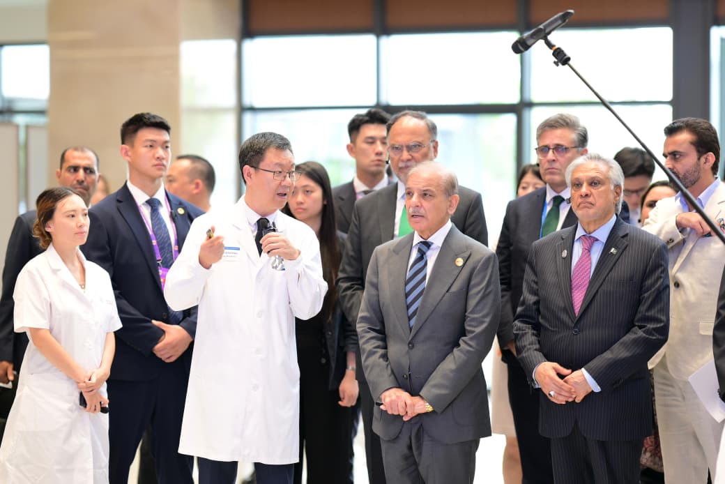 PM pushes Chinese-style hospital standards, woos investors in Beijing