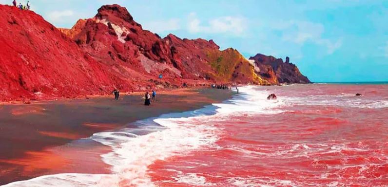 Rainfall turns Iran’s Hormuz Island shoreline red